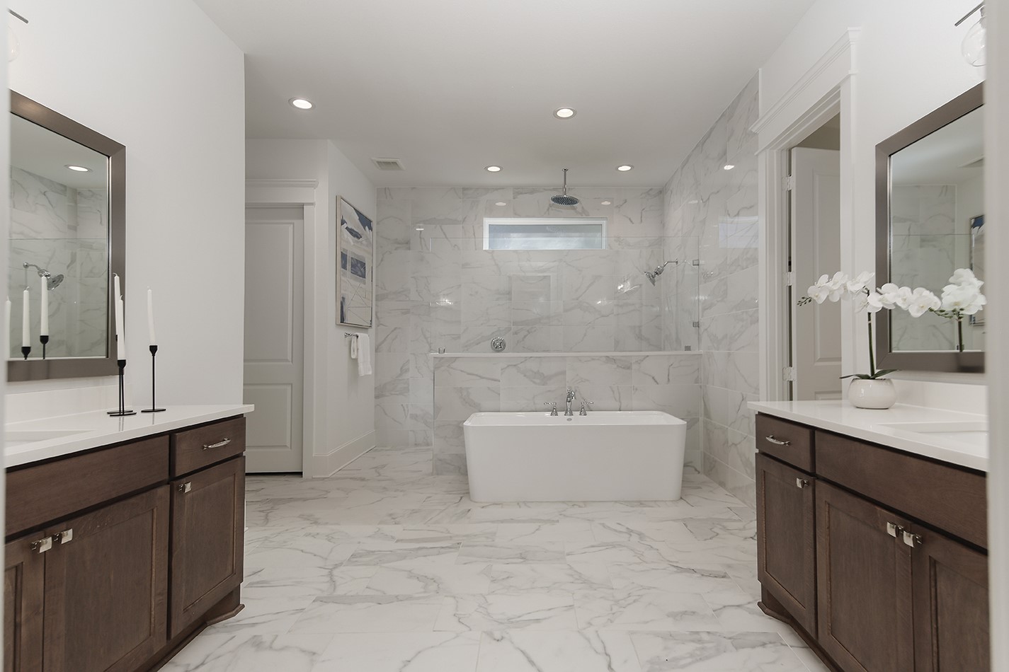 630 Lonestar Road Huntsville, TX 77340 - Photo 31 of 48 Custom dual vanities are a premium design feature with quartz counters, modern rectangle sinks and silver fixtures.