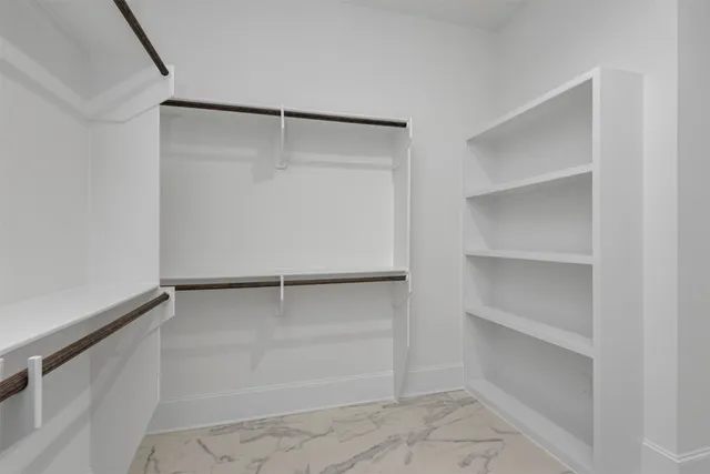 an aerial view of a house with a yard and garden