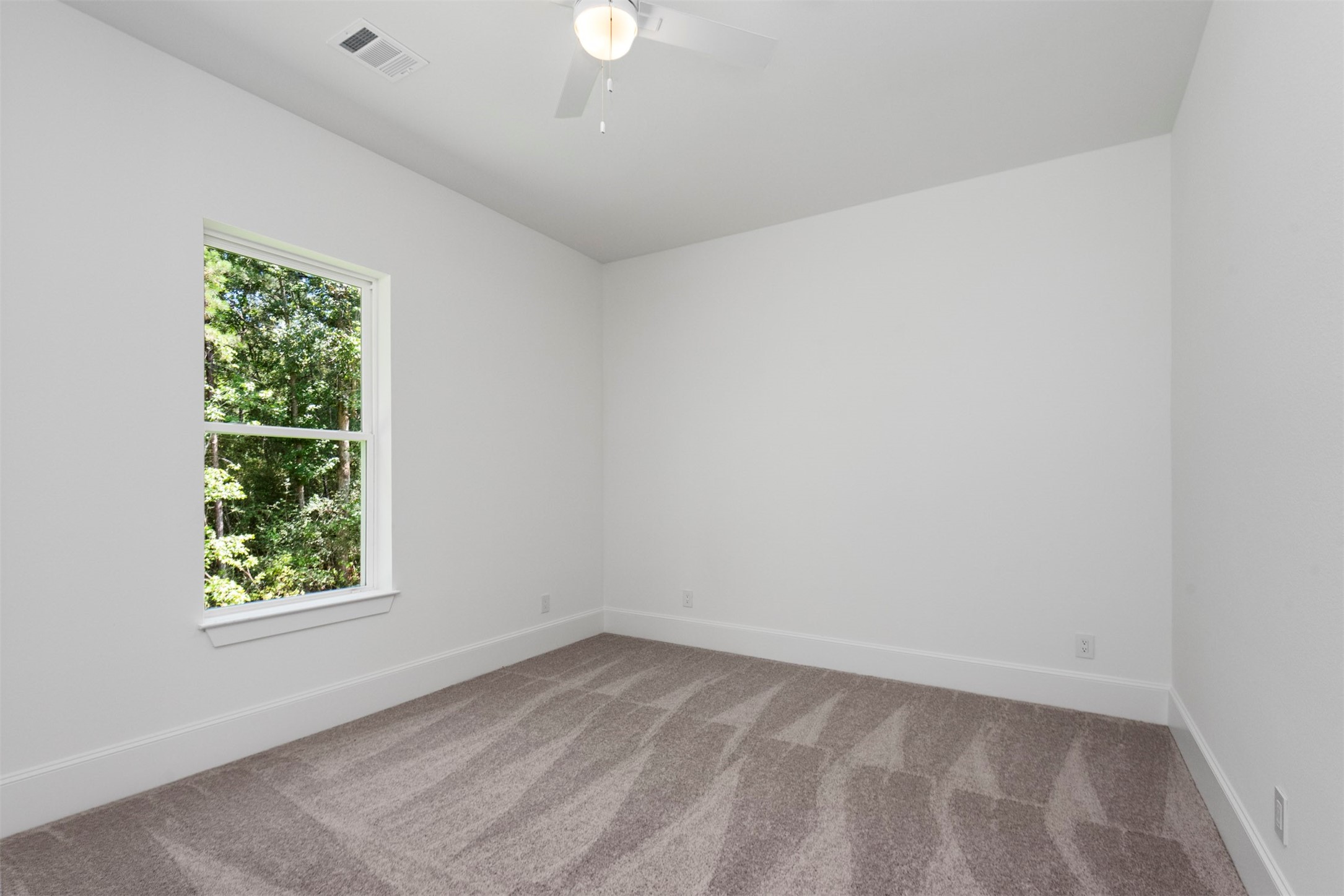 630 Lonestar Road Huntsville, TX 77340 - Photo 38 of 48 an empty room with a window