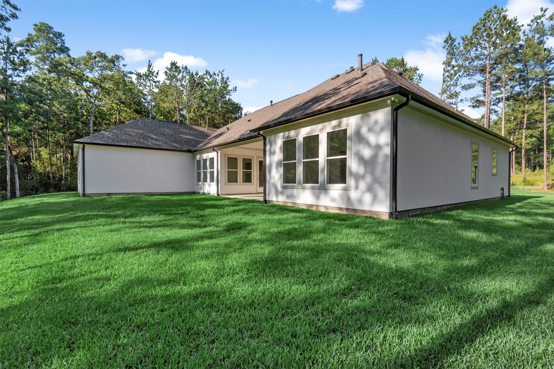 630 Lonestar Road Huntsville, TX 77340 - Photo 42 of 48 a view of a house with backyard and garden