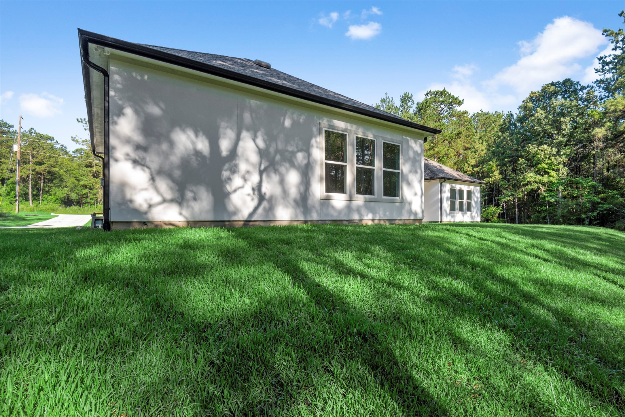 630 Lonestar Road Huntsville, TX 77340 - Photo 43 of 48 Green lawn is lovely in spacious backyard.
