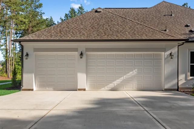 a living room with couches and a table with wooden floor
