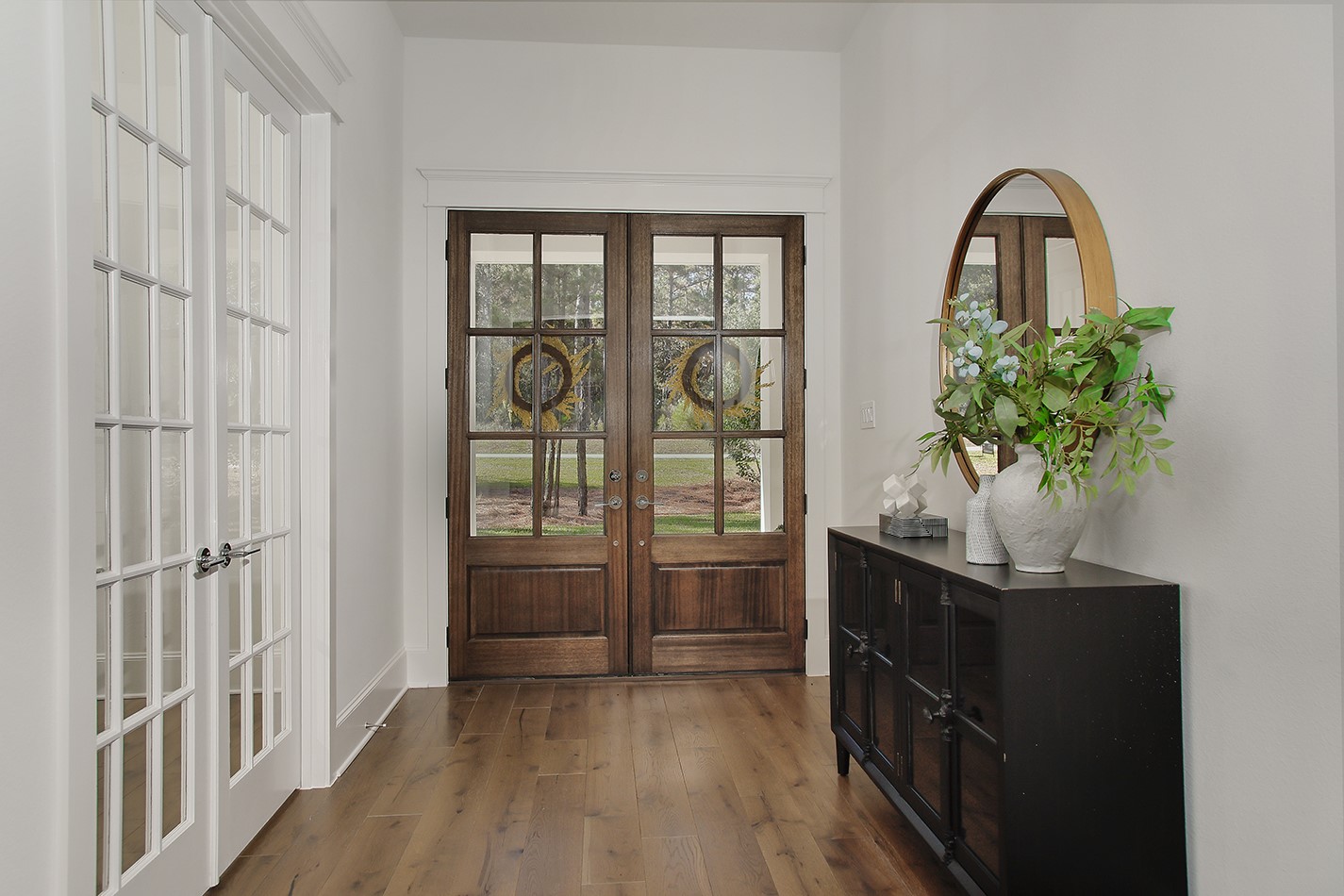 630 Lonestar Road Huntsville, TX 77340 - Photo 7 of 48 a view of entryway with wooden floor and front door