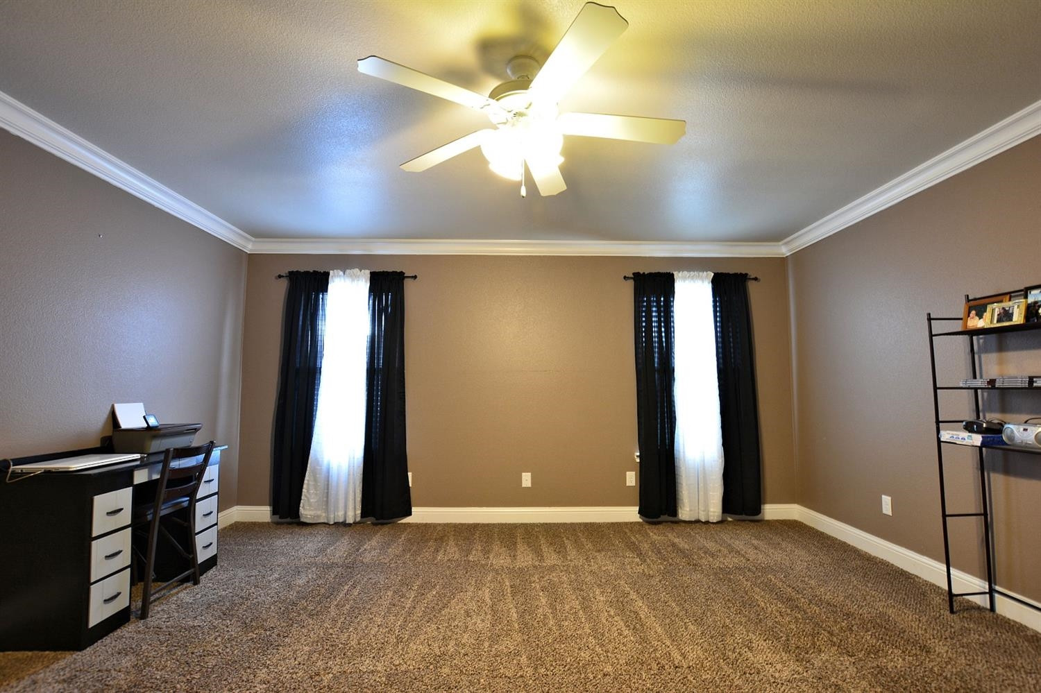 3703 Rochester Avenue Lubbock, TX 79407 - Photo 11 of 20 a view of empty room with window and ceiling fan