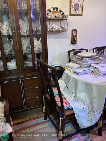 a bathroom with a mirror and cabinets
