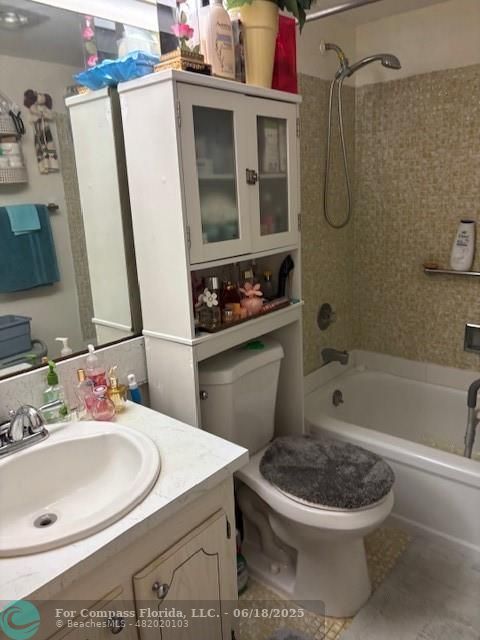 183 Camden H, Unit 183 West Palm Beach, FL 33417 - Photo 8 of 9 a bathroom with a sink a toilet and shower