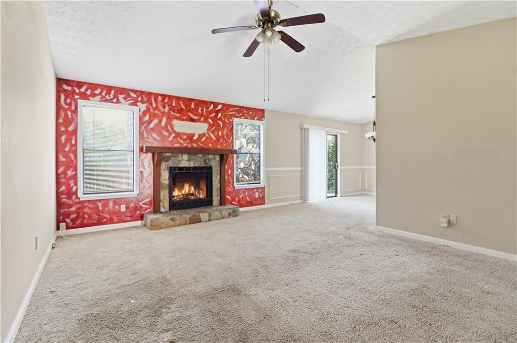 5288 Biffle Downs Road Stone Mountain, GA 30088 - Photo 8 of 18 a view of empty room with a fireplace