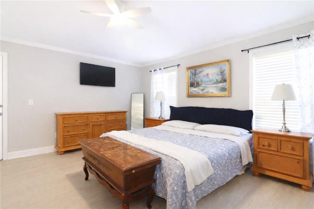 4650 Perry Road Gainesville, GA 30506 - Photo 20 of 41 a bedroom with a bed and a flat screen tv