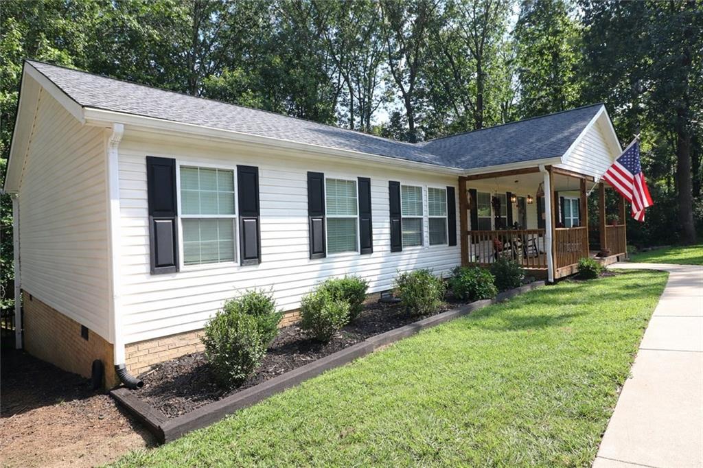 4650 Perry Road Gainesville, GA 30506 - Photo 2 of 41 a view of a house with garden and yard