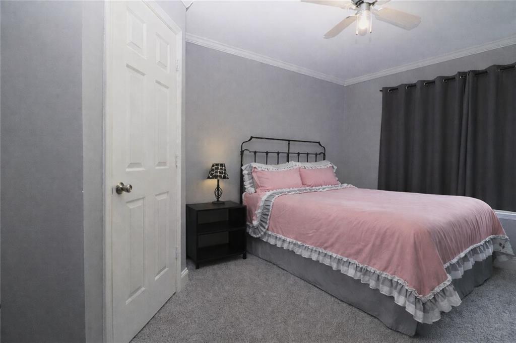 4650 Perry Road Gainesville, GA 30506 - Photo 24 of 41 a bedroom with a bed and cabinet