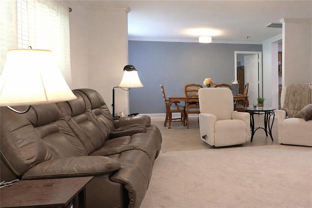 4650 Perry Road Gainesville, GA 30506 - Photo 5 of 41 a living room with furniture and a lamp