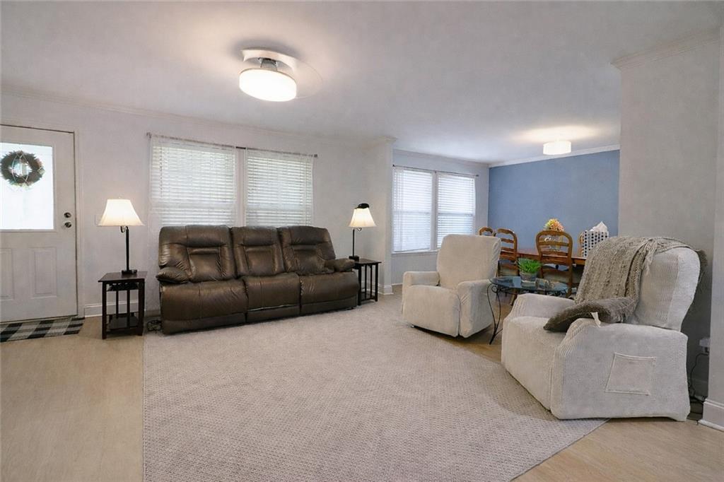 4650 Perry Road Gainesville, GA 30506 - Photo 7 of 41 a living room with furniture and a lamp