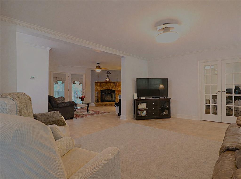 4650 Perry Road Gainesville, GA 30506 - Photo 8 of 41 a living room with furniture and a flat screen tv