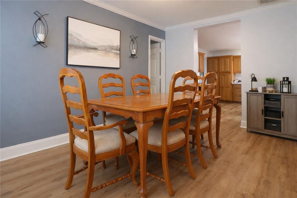 4650 Perry Road Gainesville, GA 30506 - Photo 9 of 41 a dining room with furniture and wooden floor