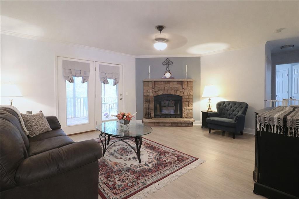 4650 Perry Road Gainesville, GA 30506 - Photo 10 of 41 a living room with furniture and a fireplace