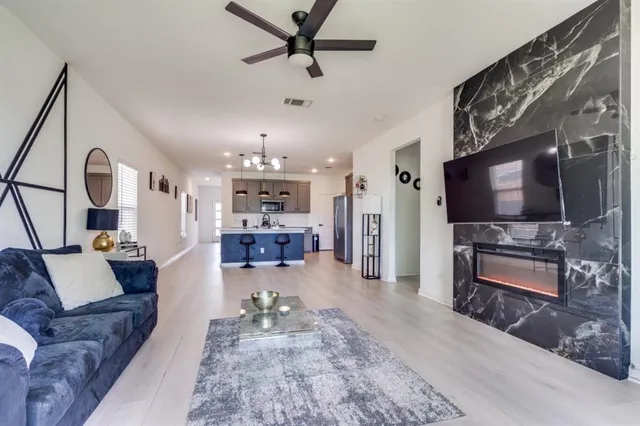 a living room with furniture and a flat screen tv