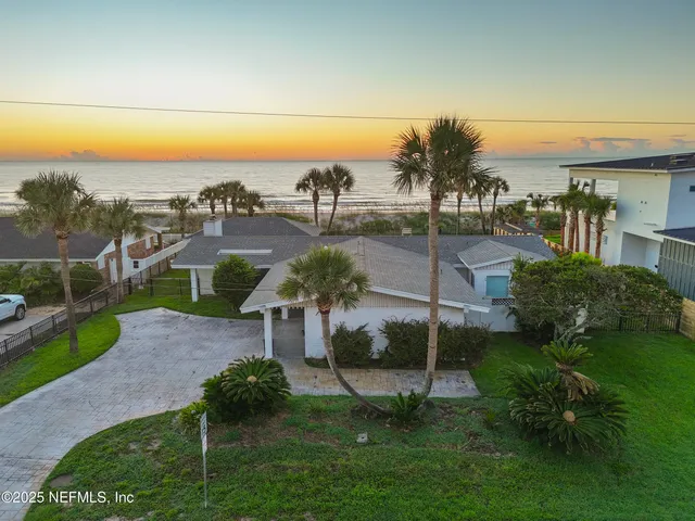 a view of a garden with a building in the background