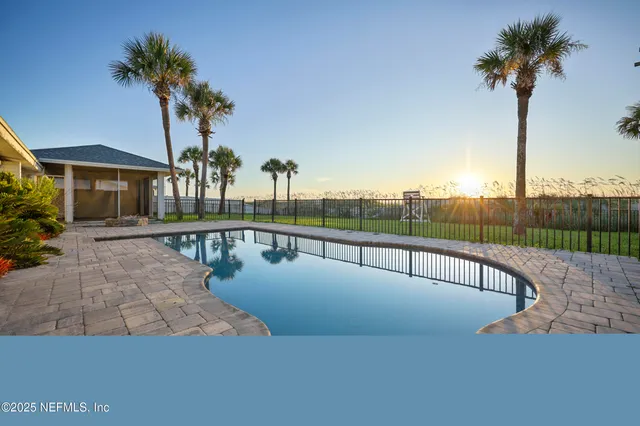 a view of a swimming pool with a deck