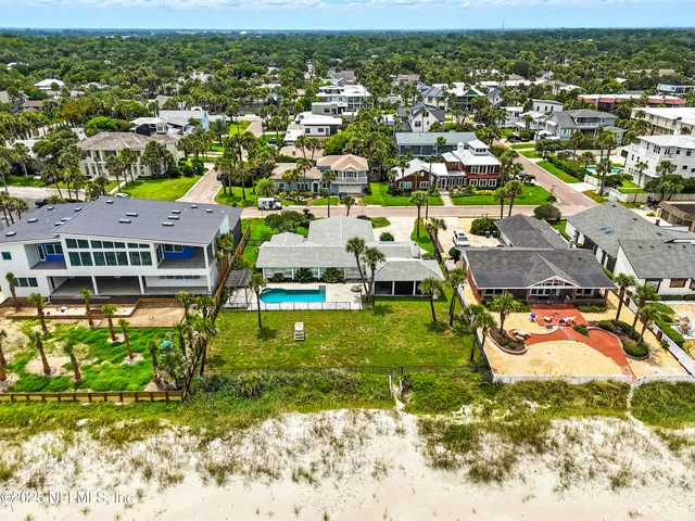 an aerial view of a house with a garden