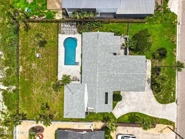 aerial view of a house with a garden