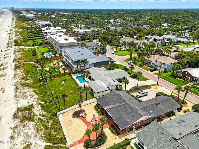 an aerial view of residential houses with outdoor space