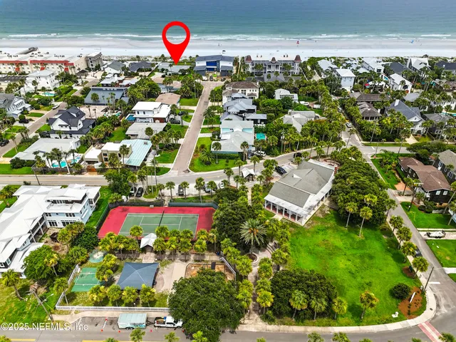 a sign that is in front of flowers