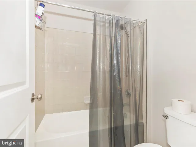 a bathroom with a shower and a tub
