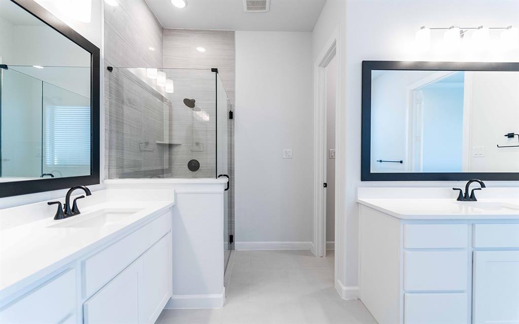 1924 Casting Ridge Mesquite, TX 75181 - Photo 17 of 30 a bathroom with a sink and a mirror