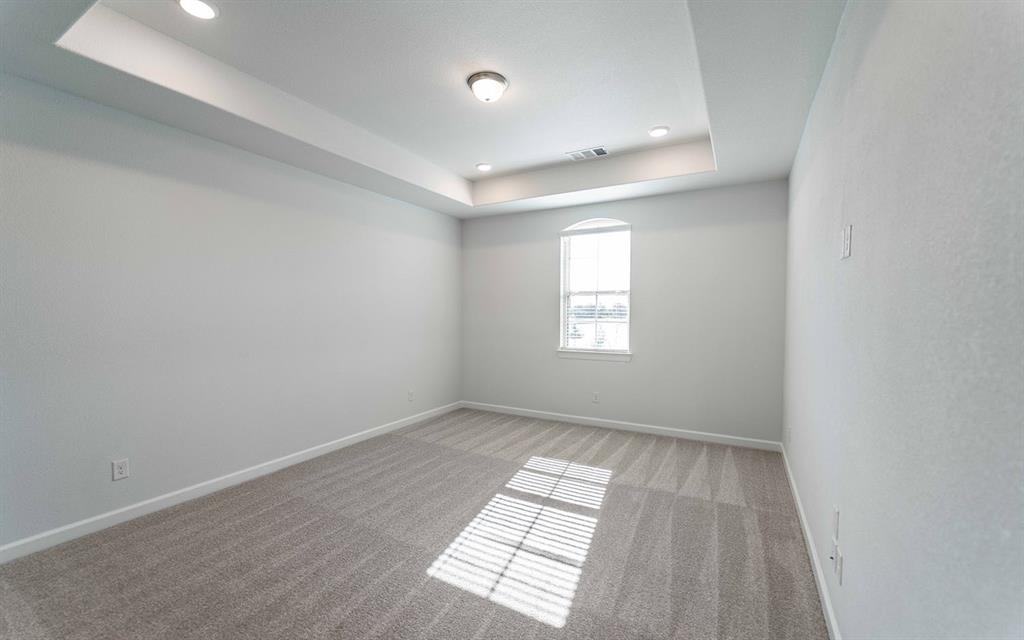 1924 Casting Ridge Mesquite, TX 75181 - Photo 20 of 30 an empty room with wooden floor and windows