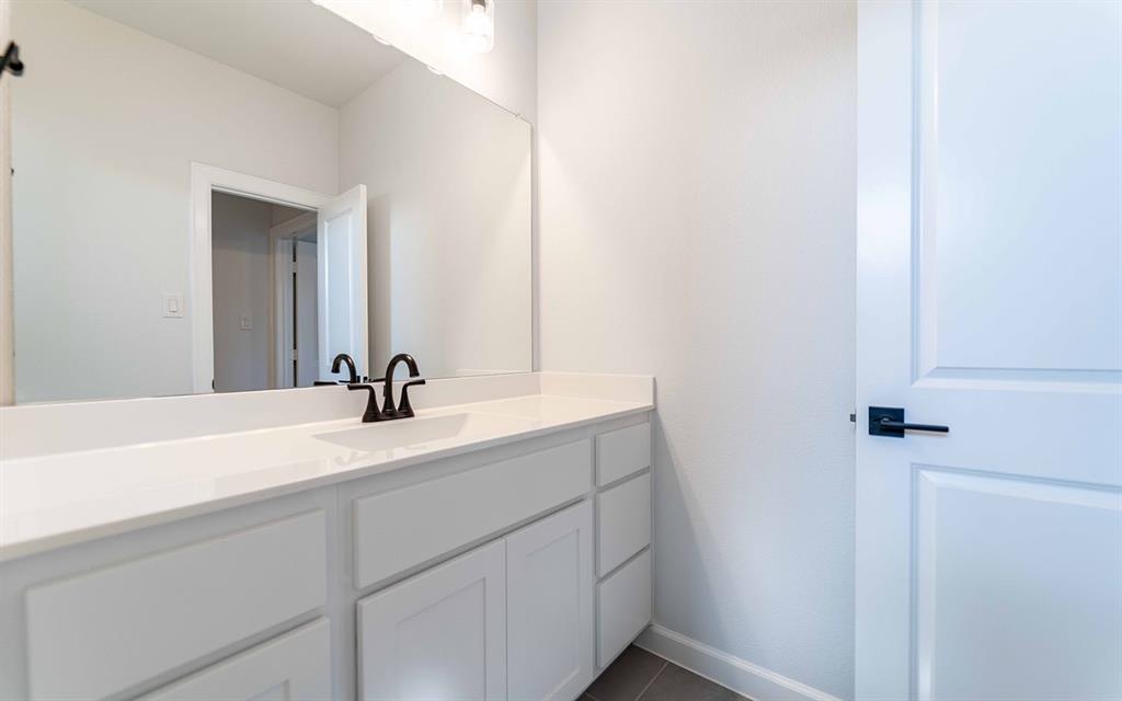 1924 Casting Ridge Mesquite, TX 75181 - Photo 22 of 30 a bathroom with a sink and a mirror