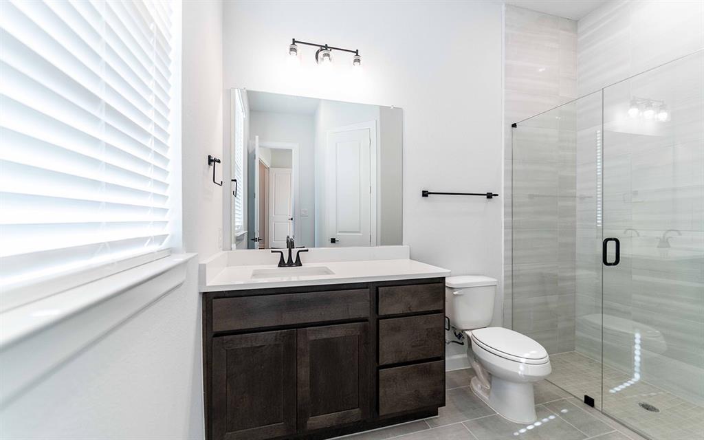 1924 Casting Ridge Mesquite, TX 75181 - Photo 24 of 30 a bathroom with a sink toilet and shower