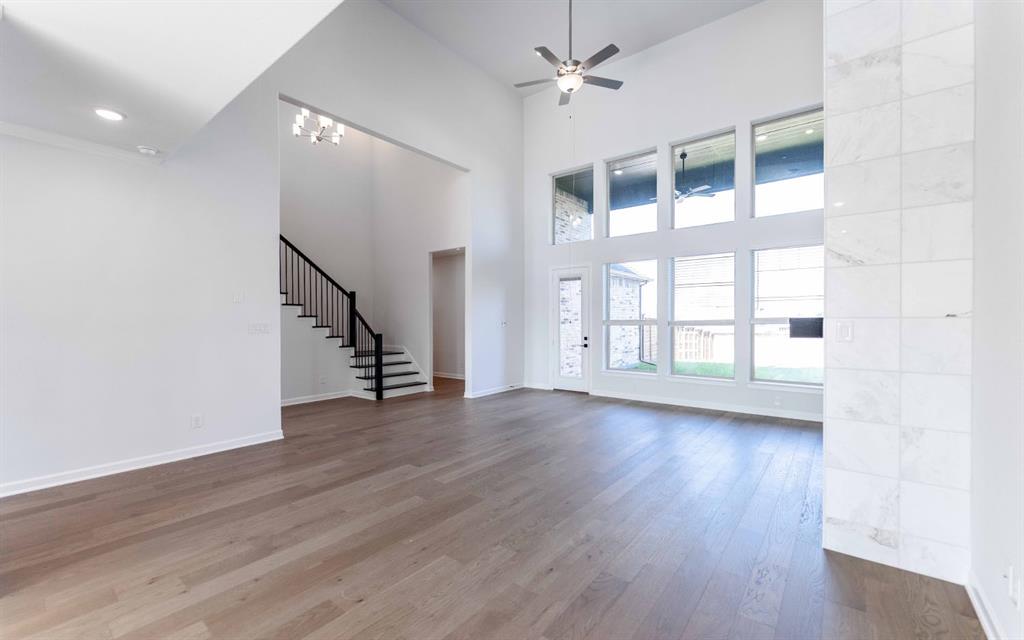 1924 Casting Ridge Mesquite, TX 75181 - Photo 7 of 30 a view of an empty room with wooden floor and a window