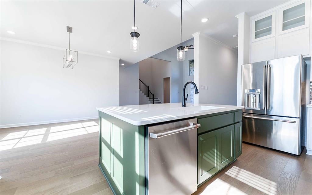 1924 Casting Ridge Mesquite, TX 75181 - Photo 10 of 30 a kitchen with kitchen island a sink stainless steel appliances and refrigerator