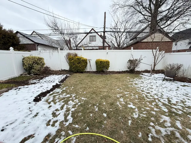 a view of a backyard of the house