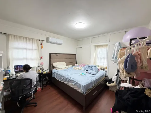 a bedroom with a bed and a walk in closet