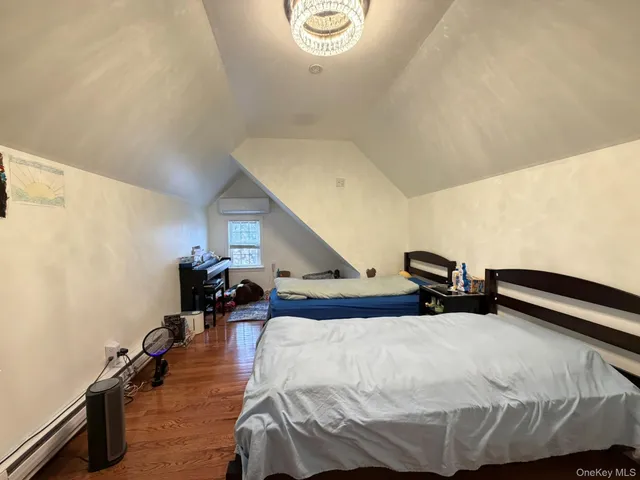 a bedroom with bed and window