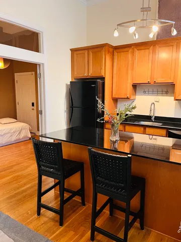 a view of a dining room with furniture and window