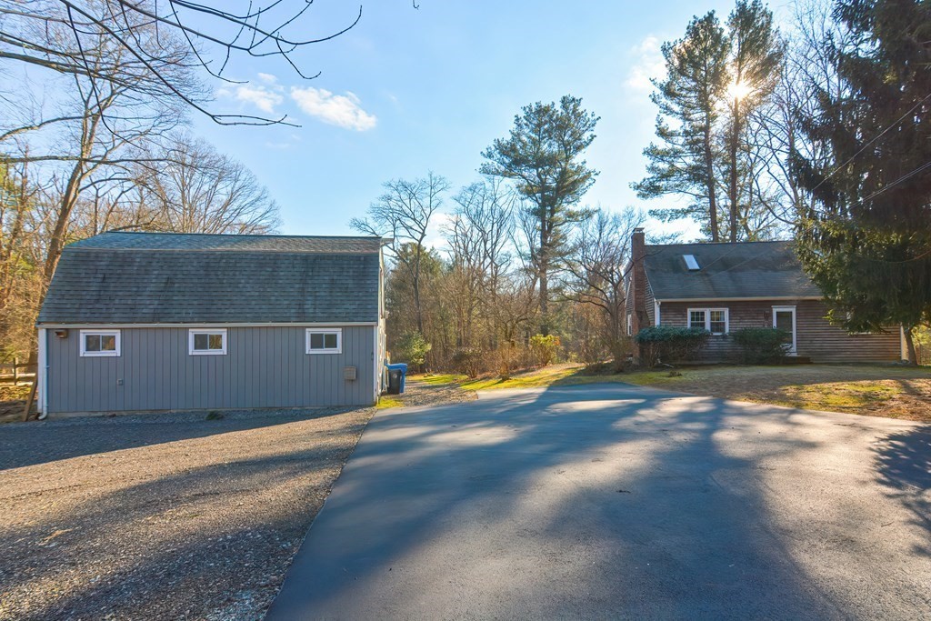 325 Spring Street Wrentham, MA 02093 - Photo 14 of 42 a front view of a house with a yard