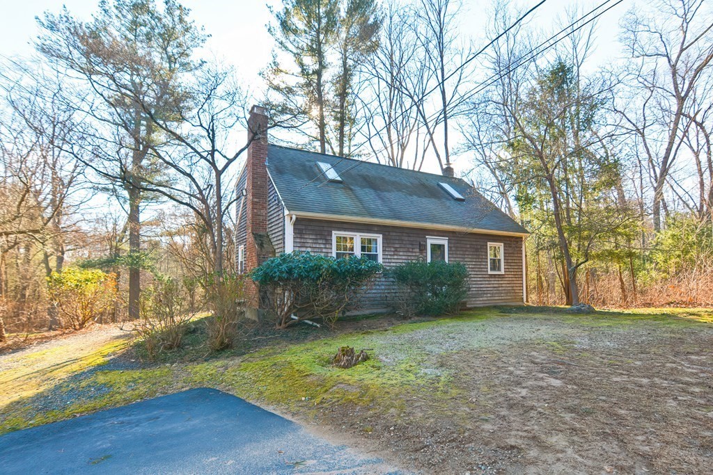 325 Spring Street Wrentham, MA 02093 - Photo 15 of 42 a view of a yard in front of a house with large trees