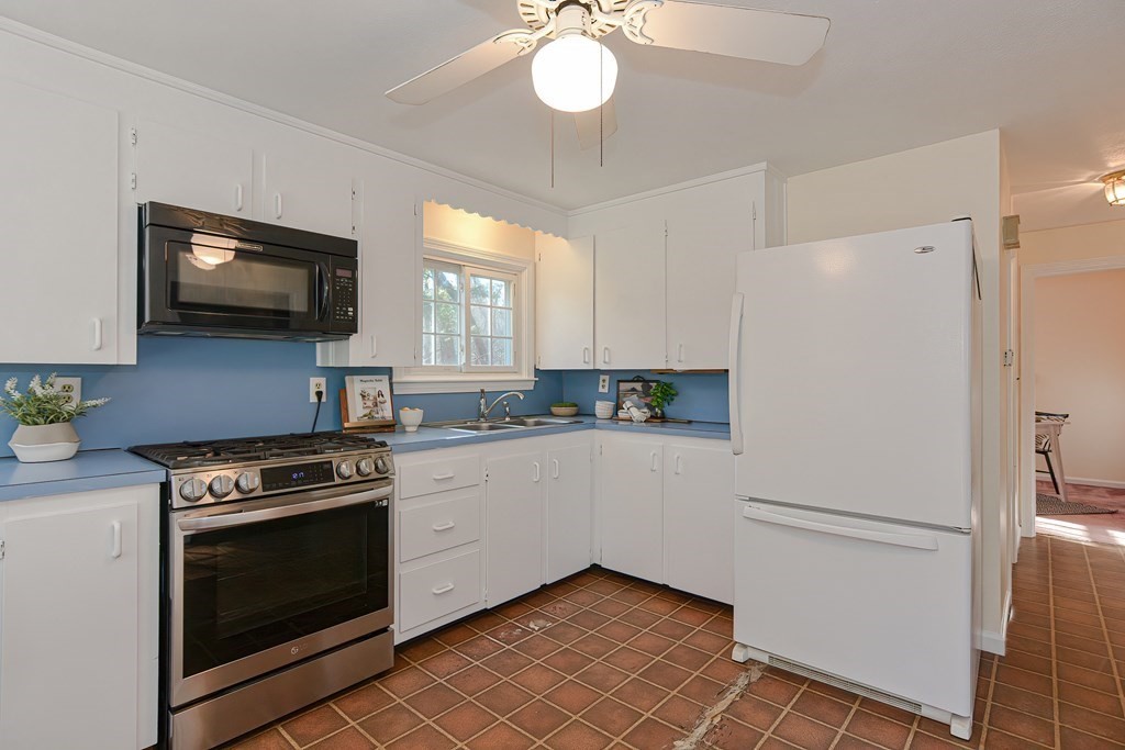 325 Spring Street Wrentham, MA 02093 - Photo 19 of 42 a kitchen with a stove and a refrigerator