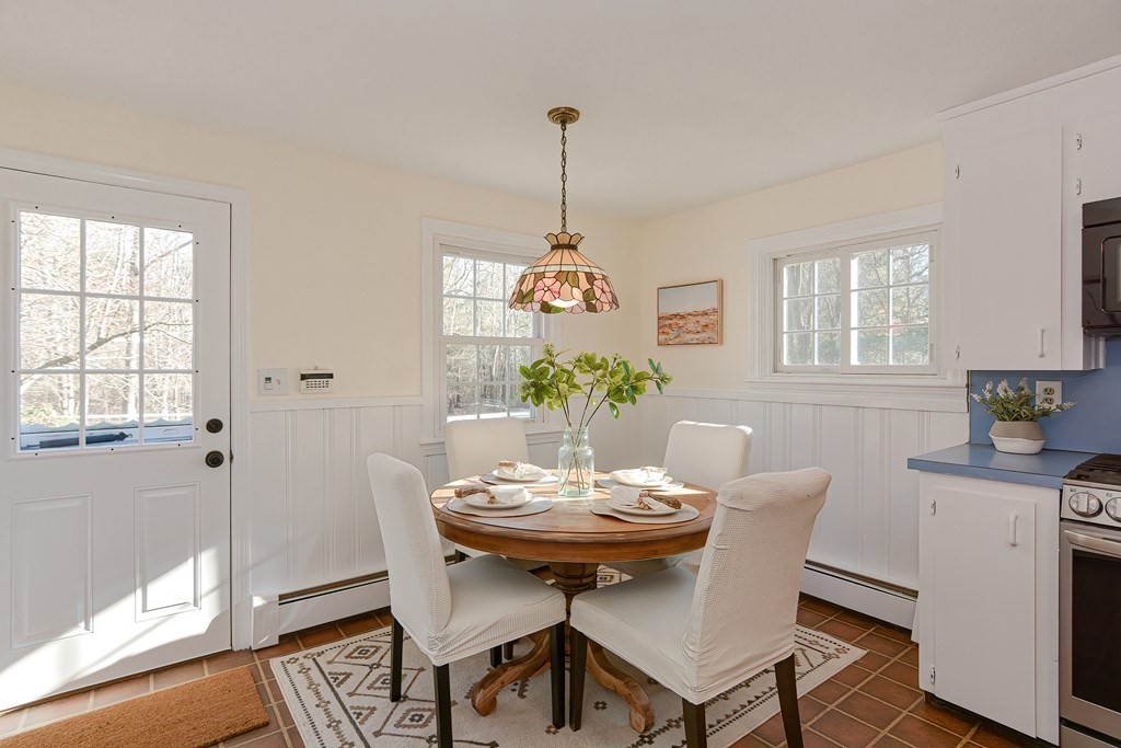 325 Spring Street Wrentham, MA 02093 - Photo 20 of 42 a view of a dining room with furniture window and wooden floor