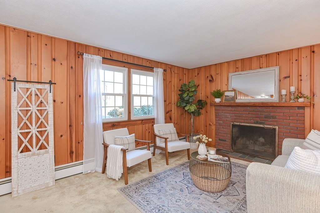 325 Spring Street Wrentham, MA 02093 - Photo 25 of 42 a living room with furniture and a fireplace