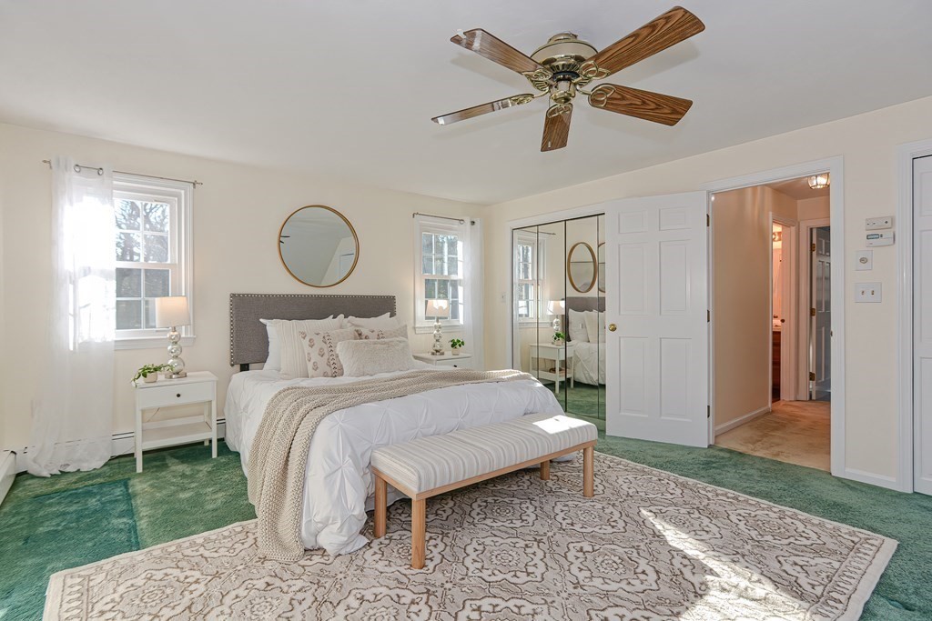 325 Spring Street Wrentham, MA 02093 - Photo 35 of 42 a bedroom with a bed a table and chair