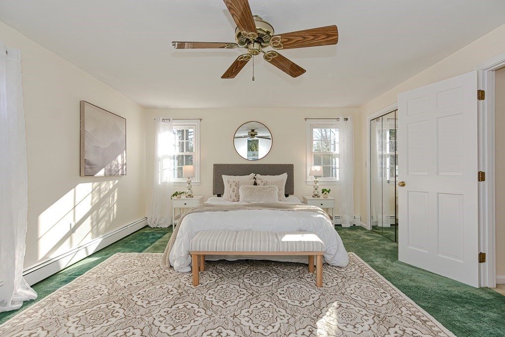 325 Spring Street Wrentham, MA 02093 - Photo 37 of 42 a bedroom with a bed mirror and window