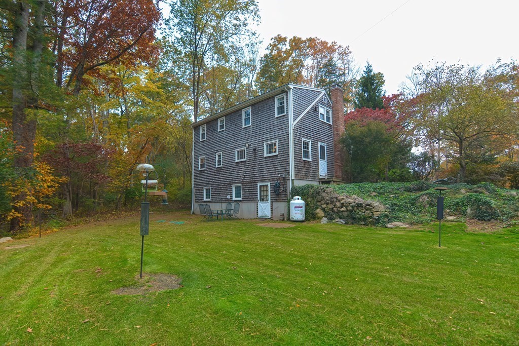 325 Spring Street Wrentham, MA 02093 - Photo 4 of 42 a brick building with a yard