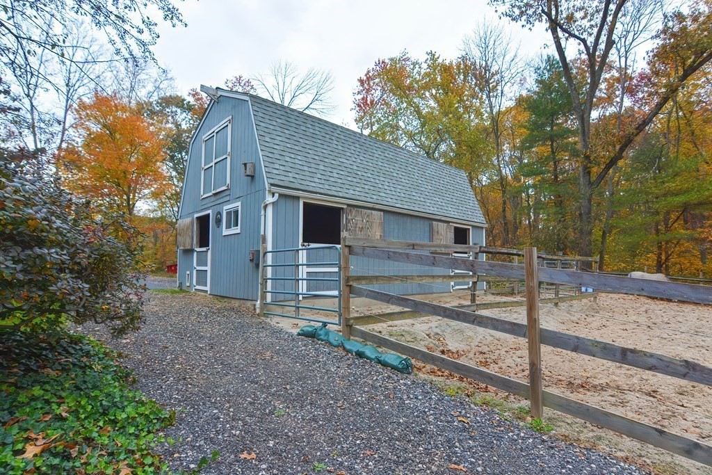 325 Spring Street Wrentham, MA 02093 - Photo 8 of 42 a view of a house with a yard and large tree