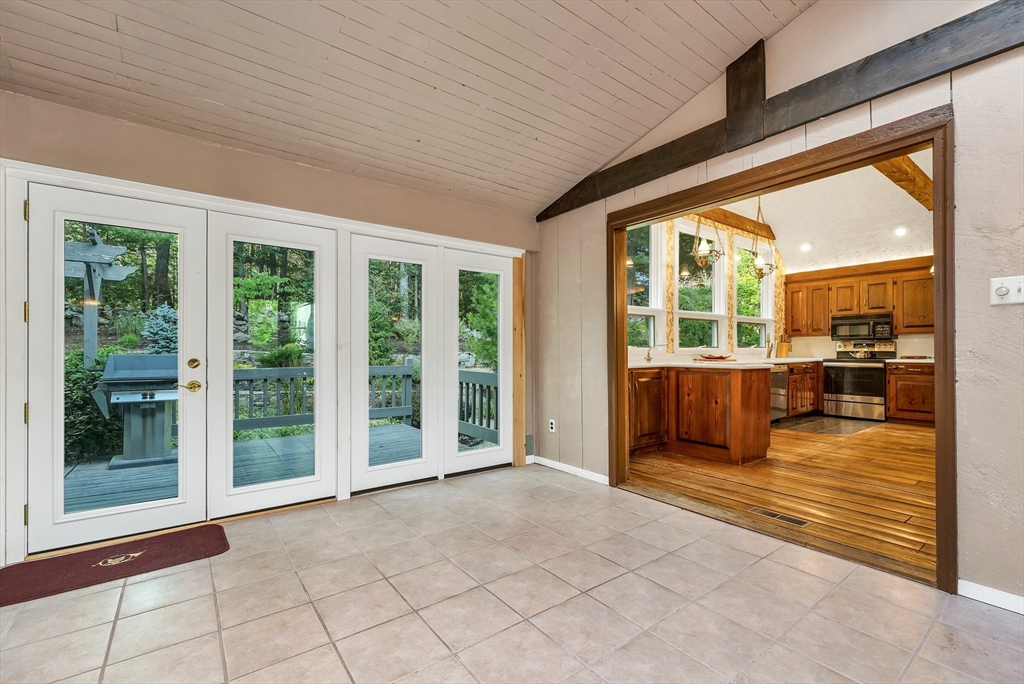 3 Burning Bush Drive Boxford, MA 01921 - Photo 23 of 42 a view of an entryway with wooden floor and a livingroom view