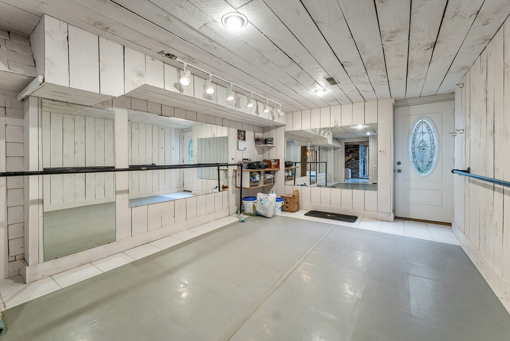 3 Burning Bush Drive Boxford, MA 01921 - Photo 39 of 42 a view of an empty room with kitchen and entryway