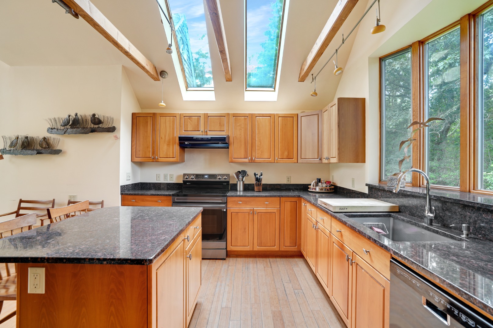174 Middle Road Chilmark, MA 02535 - Photo 9 of 40 a kitchen with stainless steel appliances granite countertop a sink a stove and a wooden cabinets