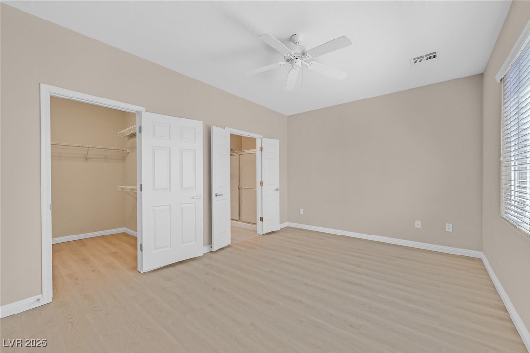 2407 Jada Drive Henderson, NV 89044 - Photo 20 of 42 Master bedroom walk in closet has new Luxury Vinyl
